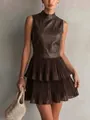 Close-up detail of sleeveless PU leather patchwork dress with double-layered pleated hem. - S / Dresses / Coffee