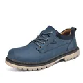 Detail view of blue nubuck men's work boots with durable beige lug sole - 38 / Blue