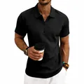 Close-up of men's black waffle knit polo shirt featuring a zipper neck design. - S / Tops / Black