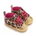 Close-up of leopard print baby shoes with shiny gold toe caps and hot pink laces - Leopard (No Rivets)