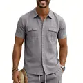Detailed view of men's grey linen short-sleeve shirt with lapel collar and chest pockets - S / Tops / Gray