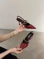 Close-up of red pointed-toe slingback heels with gold metallic strap detail - 34 / 6cm Stiletto / Burgundy