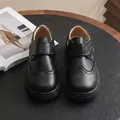 Black British style boys' leather shoes with Velcro straps and brogue details - Carved Style