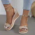 Detailed close-up view of champagne glittery wedge sandals with gold ankle straps - 36 / Gold