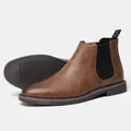 Detailed macro view of classic brown Chelsea boots side profile and non-slip rubber sole. - Burnished Brown (KD138)
