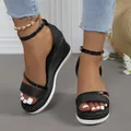 Detailed close-up of black glitter wedge sandals featuring a platform rope sole and ankle strap - 36 / Black