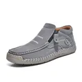 Close-up of handmade gray suede high-top casual shoe with side zipper and white stitching. - Gray