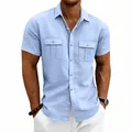 Detail of a light blue men's linen short-sleeve shirt with functional flap chest pockets. - Light Blue
