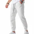 Détail d'un pantalon jogger en lin blanc à rayures pour homme avec cordon - Blanc