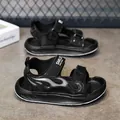 Black children's sports sandals featuring a flame pattern and adjustable velcro straps - 27 / Obsidian Black