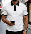 Close-up of men's white waffle knit polo shirt with black contrast zip collar and pocket - S / Tops / White