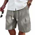 Detailed close-up of men's gray slub cotton linen cargo shorts with drawstring waist. - Dark Gray