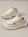 Zapatillas deportivas de moda para mujer en crema y dorado con detalle de cremallera - Blanco Roto