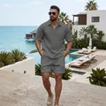 Men's grey waffle-knit resort wear set with half-zip polo and casual shorts. - Gray