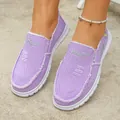 Close-up of purple canvas slip-on shoes with embroidered daisy and frayed edges - 36 / Purple