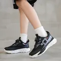 Baskets de sport noires modernes pour enfants avec boucle rotative et semelles blanches - Noir