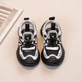 Lightweight boys' breathable mesh sports sneakers featuring a durable tire-textured sole - Black