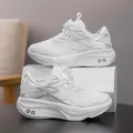 Kids' breathable white mesh running shoes featuring rotating dial buckle closure system - 31 / Standard White