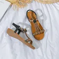 Sandales plates bohèmes pour femmes avec bride élastique, coloris marron et noir chic. - 35 / Noir