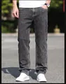 Detailed view of men's loose straight-leg jeans in a stylish smoky grey wash finish - 28 / Bottoms / Smoke