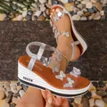 Fashionable silver wedge sandals featuring rhinestone butterflies and transparent straps - Silver