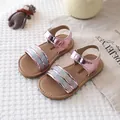 Close-up of pink metallic girls sandals with sequin strap on a soft textured mat. - Size 21-25 Mixed / Single Strap Style (3308) / Pink