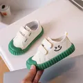 Comfortable toddler cream canvas shoes featuring green rubber soles and cute smiley face - Green