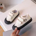 Toddler off-white canvas shoes with a cute smiley face design and double velcro straps - Black