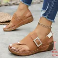Tan wedge thong sandals for women featuring a rhinestone buckle and 4.5cm platform heel - 36 / Brown