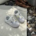 Detailed view of breathable white mesh toddler sneakers featuring cute daisy flower ornaments - 22-25 (Min. 4 Pairs) / Beige
