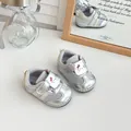 Detailed view of silver mesh infant shoes with breathable fabric and soft sole - Silver