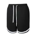 Men's athletic black waffle textured shorts featuring white drawstrings and hem stripes - Black