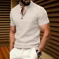 Detail view showing the texture of the beige waffle knit Henley shirt for men - S / Tops / Khaki