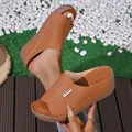 Detailed view of brown wedge sandals featuring intricate laser-cut floral patterns - 36 / Laser Cut Style (610) / Brown