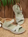 Close-up detail of the woven straps and velcro closure on sage green comfort sandals - 36 / Green