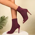 Detailed view of wine red peep toe stiletto boots made of breathable fly-knit fabric - 35 / Burgundy