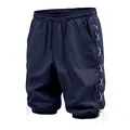 Detailed view of the navy blue linen cropped pants with side white lace-up design - S / Bottoms / Navy Blue