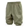 Detailed view of olive green linen drawstring shorts with white side lace-up design - S / Bottoms / Army Green