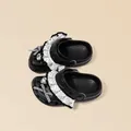 Adorable black girls' polka dot ruffle clogs featuring checkered bows and heart rhinestones - Black