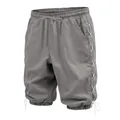 Detail view of grey linen cropped pants with side lace-up design and drawstring cuffs - Dark Gray