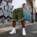 Olive green quilted streetwear shorts for men with loose fit in street setting - Army Green