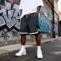 Men's dark gray quilted casual shorts featuring a loose fit in a street style setting - S / Bottoms / Gray