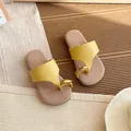 Yellow leather thong sandals for women with gold ring detail on warm textured background - Size 23: 15.0cm / Yellow