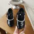 Detailed view of girls' black patent leather Mary Jane shoe with pearls and bow - 26*16 / Black