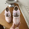 Detailed view of pink girls' patent leather shoes with pearl trim and organza bow - 26*16 / Pink