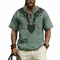 Close-up detail of the vintage black Celtic knot print on a green slub linen V-neck shirt - S / Tops / Army Green