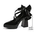 Elegant black patent leather chunky heel pumps with cross straps and large bow detail - 35 / Black