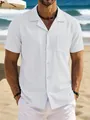 Macro view of white cotton linen men's casual short-sleeve shirt with pocket on beach - S / Tops / White