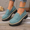 Detailed macro view of vintage blue-green suede platform loafers with thick black soles - 36 / Green