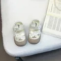 Close-up of elegant white baby girl sandals with decorative flowers and pearl centers - 22 (Inner Length 14cm) / Beige